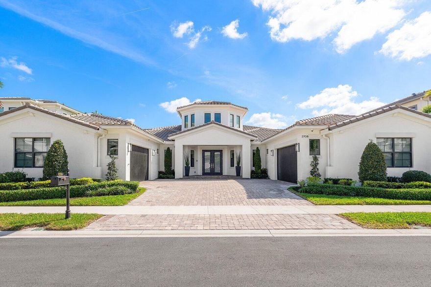 Exquisite in every detail, this completely renovated and redesigned 6-bedroom, 7 bathrooms custom one-story estate in the prestigious gated community of Royal Palm Polo Signature Collection is designed with a thoughtful 3-way split floor plan. Long lake vistas, southern exposure 4 car garage with epoxy flooring and custom cabinets, whole house generator, impact glass and more.Upon entering, you'll be captivated by the marble flooring, custom fixtures, and striking tray ceilings that enhance the home's contemporary elegance. The expansive master suite, tucked away in its own private wing, features two walk-in closets, a spa-inspired bathroom with dual sinks, two private water closets, and a shared glass-enclosed shower, along with a private breakfast bar complete with a fridge and sink