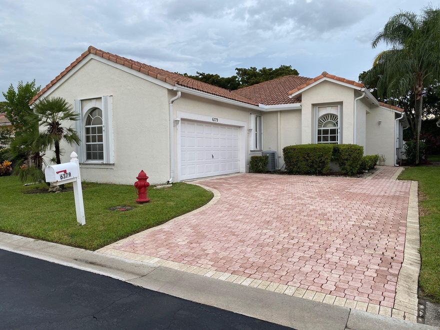 SPECTACULAR 4 bedroom home with 2-car garage & fully fenced private backyard in gated community.  All tile flooring.  Spacious kitchen features Corian counters, neutral cabinetry.  Large Master has 2 generous walk-in closets, dual sinks, separate tub & shower.  Nice sized Family room with Separate Dining/Living room.  Breakfast area off the kitchen.   Laundry room with sink.  Large screened/covered patio overlooks huge open patio area plus storage shed.  Newer Accordion shutters. New A/C 2019.  Community pool.  HOA includes:  gate, lawn, Basic cable plus internet, roof cleaning approx. every 3 years.   Convenient location close to shopping, restaurants, schools, beaches & major airport.