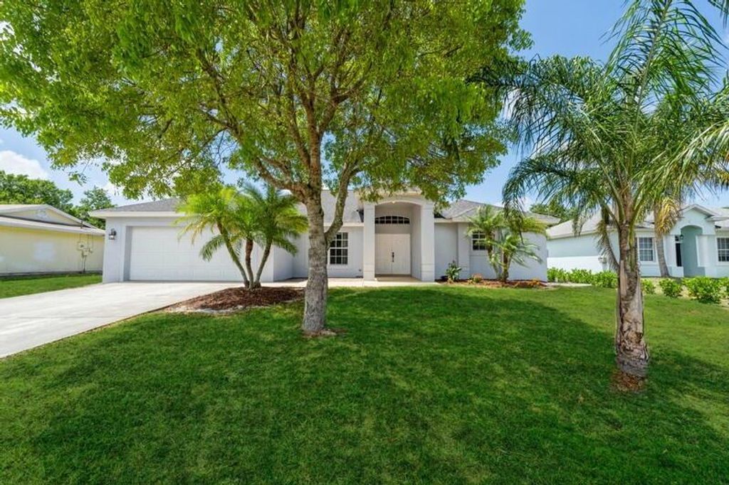 Photo of 3572 SW Vollmer Street, Port Saint Lucie, FL 34953 (MLS # R10794235)