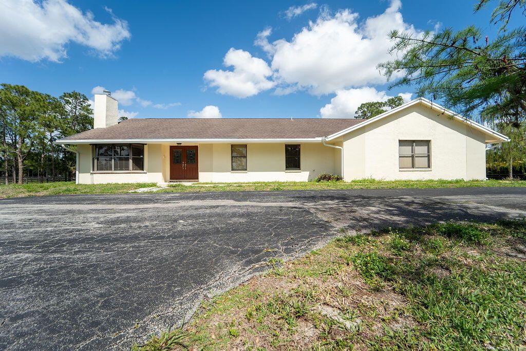 Photo of 5562 Reynolds Road, Lake Worth, FL 33449 (MLS # B26015486)