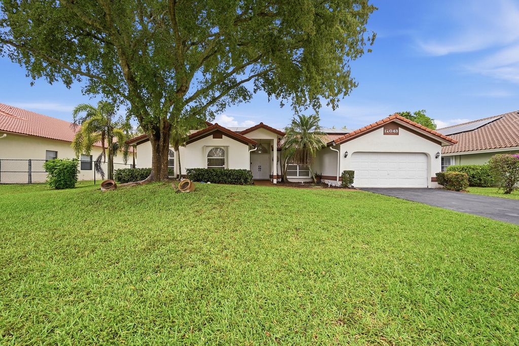 Photo of 12043 SW 1st Street, Coral Springs, FL 33071 (MLS # B26019948)