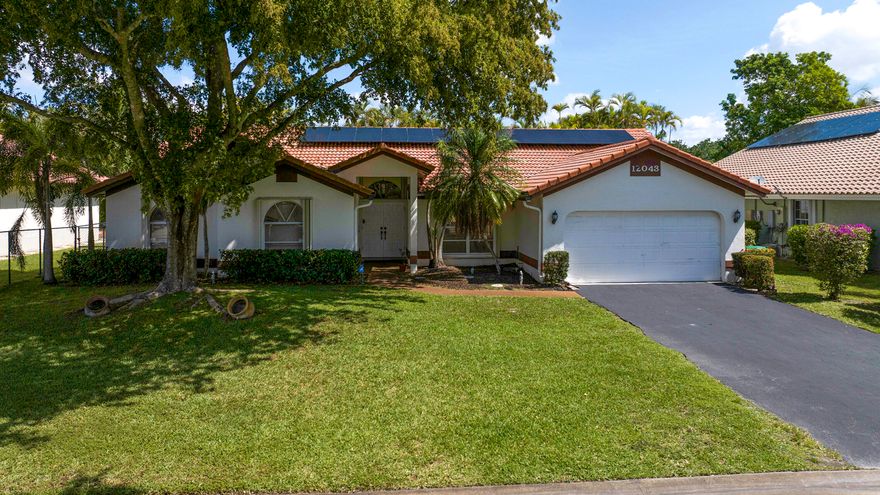 Spacious 4-bedroom, 2.5-bathroom pool home in Coral Springs offering comfort, efficiency, and a prime location. Features vaulted ceilings and an open-concept floor plan with generously sized living, dining, and casual areas. Highlights include stainless-steel appliances and tile flooring throughout—ideal for everyday living and entertaining. Updated with 46 eco-friendly solar panels for significant energy savings. Enjoy a private backyard oasis with a pool, large covered porch, and an expanded full-length pavered patio, perfect for outdoor relaxation. Low annual HOA fee of $650. Ideally located near parks, shopping, dining, and major roadways for convenient access to airports. This is a rare chance to make the sought-after West Glen community your new home. It truly is a must-see property.