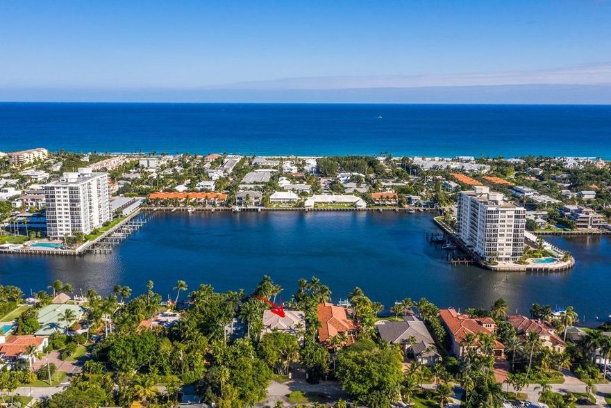 Estate Waterfront Home in Beautiful Delray Beach is Move-in Ready
Located in the Marina District of Delray Beach, this 7,900 SF estate home with 5 bedrooms and 5.5 baths is offered with most of the fine custom furnishings included.  The magnificent interior design was done by Marc-Michaels, blending seamlessly with the architectural design of Stuart Brenner and the impeccable craftsmanship of well-known custom builder, Jeff Norman.

Enter the home through the mahogany doorway to the foyer and allow your eyes to feast upon the classic design. As you make your way to the open floor plan you can see that it takes an inspired turn into a decidedly modern home that is both comfortably livable and artfully sophisticated. Designed for easy living and great entertaining, the expansive living room, large family room, and den are directly accessible from the gourmet kitchen with its center-island prep area and spacious workspace, all with granite countertops. The appliances are stainless steel, and the hooded range features a custom tile backsplash. There's an in-kitchen dining cove and a convenient breakfast bar that opens into the family room that can be used for appetizers and drinks.

The large master bedroom suite with sitting area has oversized walk-in closets, a walkout balcony and fantastic views of the pool area and dock.  The adjoining master bath has a large tub, walk-in shower, dual sinks, bidet and a separate vanity area.

For everyday living or entertaining, the indoor and outdoor spaces are designed for maximum use.  Expansive views from the home overlook the wide waters of the Intracoastal.  In a resort-style setting, the marble patio steps lead down to the open patio area and the inviting loggia with cedar ceiling that creates a true outdoor living room. The summer kitchen includes teak cabinetry, a DCS gas grill, and U-Line refrigerator.  The patio and loggia are just steps from the custom-designed resort-like salt water pool with spillover spa and arcing fountains.

A garden walkway crosses the emerald lawns to the wide water yacht dock just minutes from ocean access.  The dock is outfitted with Hydro Glow DockMaster lighting for night fishing, and stately palms and a magnificent banyan tree frame the motor court that leads to the side-entry 3-bay garage. 

Situated just minutes from the beach, you're just a few blocks south of Atlantic Avenue in downtown Delray Beach which offers some of south Florida's finest dining and entertainment.