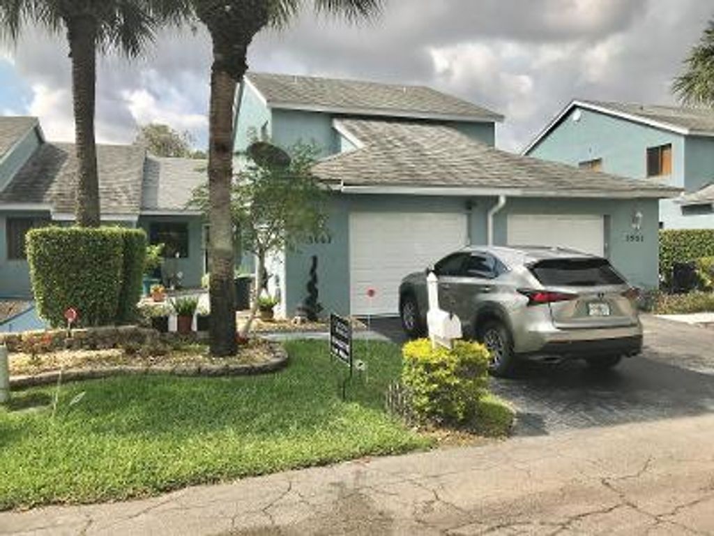 Photo of 3967 Island Club Circle Cir W, Lake Worth Beach, FL 33462 (MLS # R10710916)