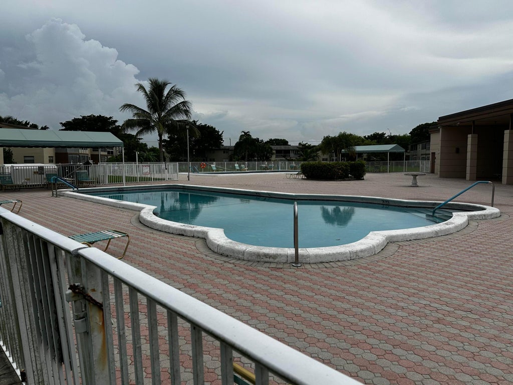 Photo of 7400 NW 5TH Place #105, Margate, FL 33063 (MLS # B26078246)