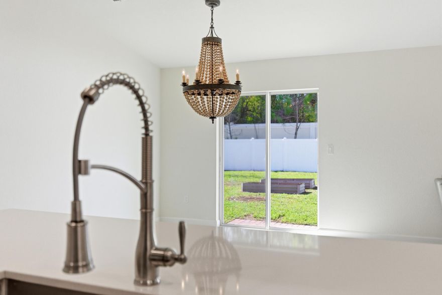 Welcome to this premiere Mediterranean style home. BRAND NEW! Built in 2020 with 4 more years left of structural warranties. Enjoy a 1/4-acre lot with a fully fenced yard giving you additional privacy and convenience for pet owners. This is the Dover floorplan, a true 3-bed, 2-bath. The kitchen boasts SS Appliances with quartz countertops, a chef's island, oversized SS sink and walk in pantry. The owner's suite features a grand bathroom with dual sinks and an expansive walk-in closet. All CBS construction ensures the best in energy efficiency & hurricane protection. The home design is WI-FI certified, has CAT 6A wiring, a Ring Video Doorbell, front door smart lock and a WIFI Thermostat. Amazing location, near I-95 for those who commute & less than 10 minutes to the beaches & downtown FP.