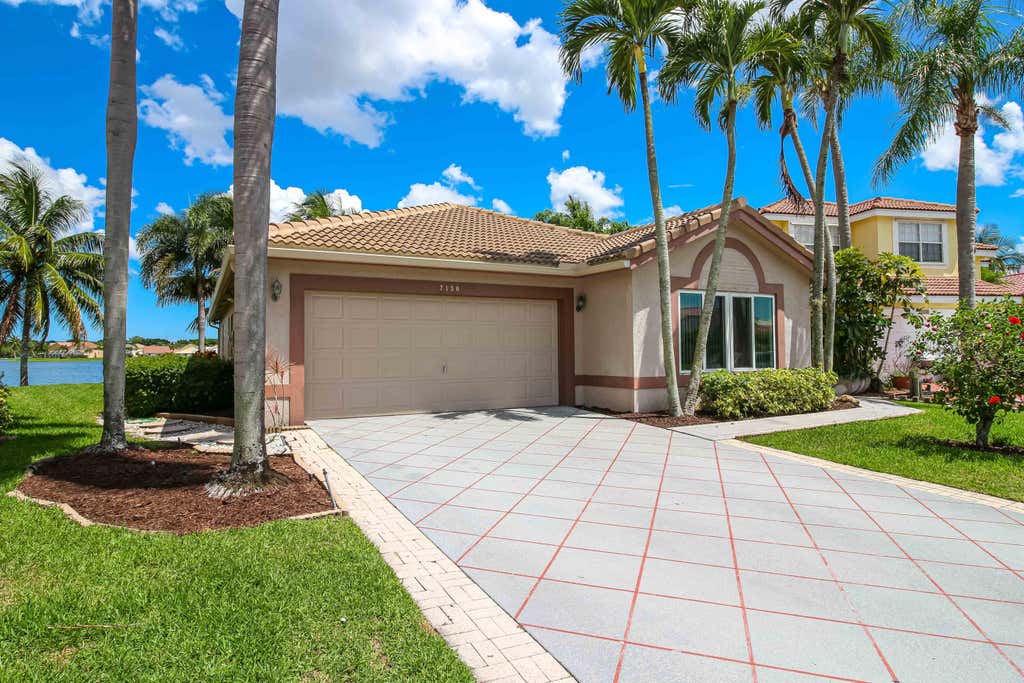Photo of 7130 Michigan Isle Road, Lake Worth, FL 33467 (MLS # B26032818)