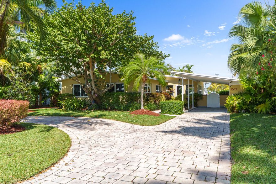 Impeccably reimagined mid-century modern waterfront residence, where timeless architecture meets sophisticated contemporary design. Deep-water access via buoyed canal—only 1 nautical mile to the Port inlet—along with 80 feet of straight-line dockage, perfectly suited for the avid boater. Bathed in natural light, the open-concept interior is anchored by a striking statement fireplace and framed by impact windows/doors that showcase water and pool views, creating a seamless flow between indoor and outdoor living. The updated kitchen features premium Sub-Zero and Thermador appliances. This well-appointed 2BR/2BA home plus separate den and waterfront study is designed for effortless entertaining and serene everyday living, minutes from Ft. Lauderdale Beach, airport, premier dining and shopping All information herein is believed to be accurate but not guaranteed. Subject to errors, omissions or changes without notice. All measurements are approximate, subject to error, omissions and changes without notice.