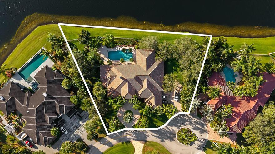 Tucked at the end of a quiet cul-de-sac in guard-gated Windmill Ranch Estates, this rare lakefront opportunity sits on nearly 1 acre (.95) with serene water views and exceptional privacy. Offering approx. 6,025 SF, the home features 5 bedrooms, 5 full baths, 2 powder rooms, a game room or theater, dedicated office, and a flex suite off the primary bedroom ideal for a nursery, gym, or private retreat. Enjoy a covered outdoor kitchen and expansive entertaining areas overlooking the lake, perfect for everyday living and sunset gatherings. A true blank canvas in one of Weston’s most coveted communities, known for exclusivity, top schools, and outstanding quality of life. A rare chance to create a dream home and lasting legacy in a trophy location. At the end of a peaceful cul-de-sac, beyond the gates of Windmill Ranch Estates, life unfolds at a different pace. Mornings begin with still water reflecting the sky, children waking to quiet surroundings, and the sense that the day ahead does not need to be rushed. Set on nearly an acre of land, this lakefront property offers rare privacy and a feeling of openness that is increasingly hard to find.With over 6,000 square feet, the home is generous yet intimate, designed to adapt as your family grows and evolves. Five bedrooms and multiple living areas allow everyone their own space, while still bringing the household together. The game room becomes a hub for laughter and memories, the office a place of inspiration and productivity. The private flex room off the primary suite transforms with time, from nursery, to fitness studio, to personal retreat, shaping itself around your life’s chapters.Outside, the home truly comes alive. The covered outdoor kitchen and expansive gathering areas invite long weekends, effortless entertaining, and evenings spent watching the sun melt into the lake. Children play freely, conversations linger, and milestones are celebrated against a backdrop that never grows old.Windmill Ranch Estates is not simply a community, it is a statement. Known for its exclusivity and timeless appeal, it offers a lifestyle rooted in privacy, prestige, and connection. Combined with Weston’s renowned schools, safety, and quality of life, this property stands as more than a home. It is an opportunity to invest in moments that matter, to build something meaningful, and to create a legacy in one of the most sought-after settings in South Florida.