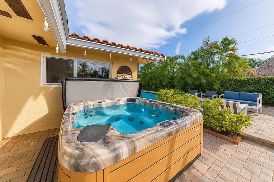 Price Reduced. Get ready to fall in love with this beautifully maintained pool home in the highly desirable Cove neighborhood of Deerfield Beach. Showings begin now and this is one you will want to see in person because homes with this combination of charm, condition and location rarely become available. A bright open floor plan, impact windows and doors, a saltwater heated pool and a private tropical backyard create the perfect setting for everyday living or a relaxing escape. Professional photography and video will be added in the next few days so be sure to check back and keep an eye out for scheduled Open Houses. This property is also a licensed fully turnkey and currently operating as a high-performing vacation rental. Welcome to The Cove lifestyle. This is a warm and inviting three bedroom two bathroom home that has been lovingly cared for and thoughtfully improved over the years. From the moment you arrive, the circular driveway, manicured landscaping and striking custom double impact glass front door set the tone for the quality that continues throughout the property. Inside, natural light fills every room and the open layout creates an easy flow from the main living spaces to the Florida room and out to the private backyard oasis.

The interior features a mix of ceramic tile, terrazzo and vinyl flooring that bring character and durability. Impact windows and doors provide peace of mind along with improved energy efficiency. The kitchen opens to the living and dining areas, creating a welcoming space to gather. Closet systems and built in cabinetry add convenience and maximized storage. The Florida room spans the back of the home with wide views of the pool and lush landscaping, making it an ideal space for relaxing, entertaining or simply enjoying quiet mornings.

Step outside and you will find one of the best features of this home. The backyard is a true getaway with a sparkling saltwater pool, heated for year round enjoyment, surrounded by tropical greenery that creates natural privacy. A hot tub sits tucked into its own nook for evenings under the stars. The screened patio offers additional living space for dining, lounging or hosting friends. A large walk in shed provides impressive storage for beach gear, tools, bikes and more. The entire outdoor area is designed for comfort and enjoyment whether you live here full time or are looking for an ideal seasonal retreat.

Practical features include a 2005 S tile roof, a one car garage with storage and laundry area, and a circular driveway that provides ample parking. The home is being offered unfurnished but has been meticulously maintained and is move in ready.

The Cove is one of Deerfield Beach's most loved neighborhoods thanks to its walkability, friendly coastal vibe and unbeatable location east of US 1. Residents enjoy quick access to the award winning Deerfield Beach shoreline, the fishing pier, waterfront dining, cafes, beachside stores, grocery shopping and everyday conveniences. Many people choose The Cove because it offers the rare blend of a relaxed beach lifestyle with the comfort of a well established residential community. You can bike or take a golf cart to the beach, stroll to local restaurants or head out for a sunset walk. With no HOA, there is flexibility for full time residents, seasonal owners and investors.

Deerfield Beach is known for its vibrant coastal energy, clean beaches, world class water activities and small town charm. Living in this area means enjoying outdoor living, community events, incredible dining options and easy access to Boca Raton and Fort Lauderdale. Whether you love paddle boarding, fishing, biking, beach yoga or simply being near the ocean, this location supports the best of the South Florida lifestyle.

Homes like this do not come to market often. Between the impact protection, heated saltwater pool, custom finishes, lush outdoor spaces and the coveted Cove location, this property stands out as an exceptional opportunity. Schedule your showing today and check back soon for updated professional photos, video and upcoming Open House dates. This is your chance to enjoy the best of coastal living in one of Deerfield Beach's most popular neighborhoods. This property is also a licensed fully turnkey and currently operating as a high-performing vacation rental.