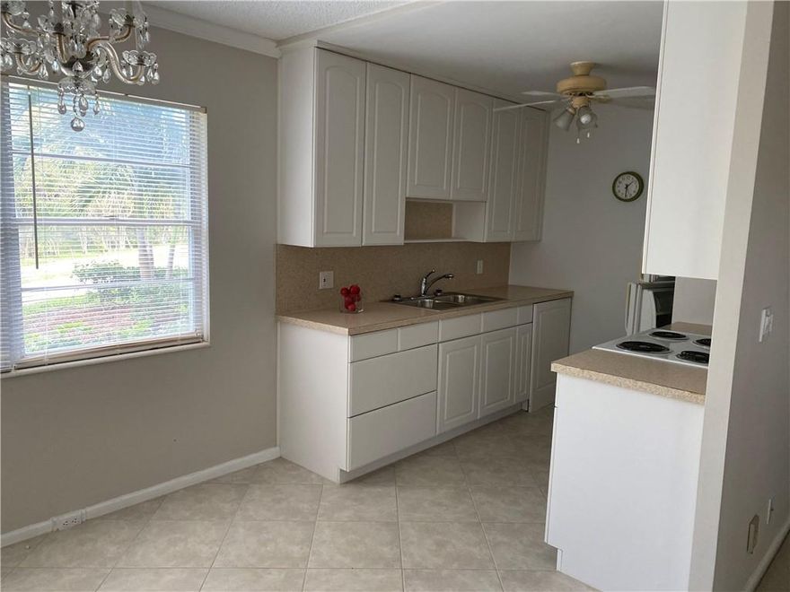 LOCATION! LOCATION! THIS FIRST FLOOR CORNER UNIT IS ONE OF THE MOST DESIRABLE LOCATIONS IN THE VILLAGE. YOU CAN'T GET CLOSER TO THE PLAZA THAT THIS! UNIT HAS NEW KITCHEN CABINETS, NEW STOVE, DOUBLE SINK. LIVING ROOM HAS CROWN MOLDING.  FLOORING IS CARPET AND TILE. MASTER BATH HAS WALK IN SHOWER. NEW SLIDING DOORS FROM BEDROOMS ON TO TILED PATIO WITH NEW ENCLOSURE. ACCORDIAN HURRICAN SHUTTERS ON WINDOWS. DOOR TO GARDEN AREA. PARKING IS RIGHT IN FRONT OF UNIT. STEPS TO UPMINSTER POOL. CLUBHOUSE HAS MOVIE THEATER, FITNESS CENTER, INDOOR POOL, MANY CLUBS AND CRAFT ROOMS. CAFE ON PROPERTY. FREE VILLAGE SHUTTLE TO MALLS AND GROCERY STORES. APPROXIMATELY 4 MILES TO BEACH. BUILDING IS RENTABLE AFTER 2 YEARS OF OWNERSHIP.
