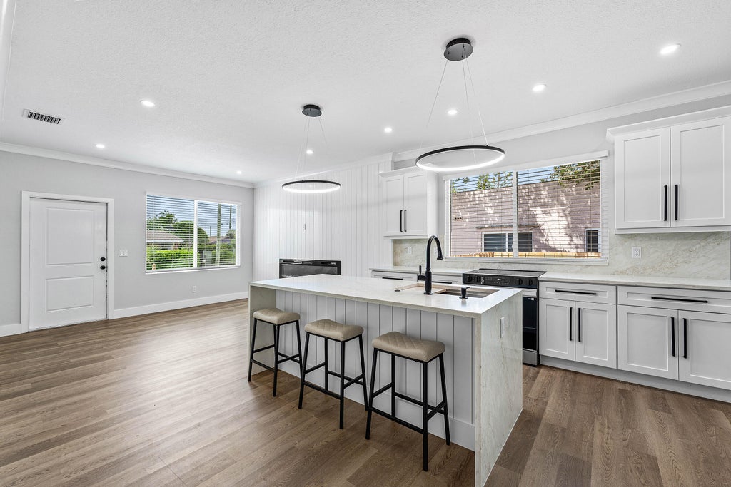 Photo of 1150 W 25th Street, Riviera Beach, FL 33404 (MLS # B26069720)