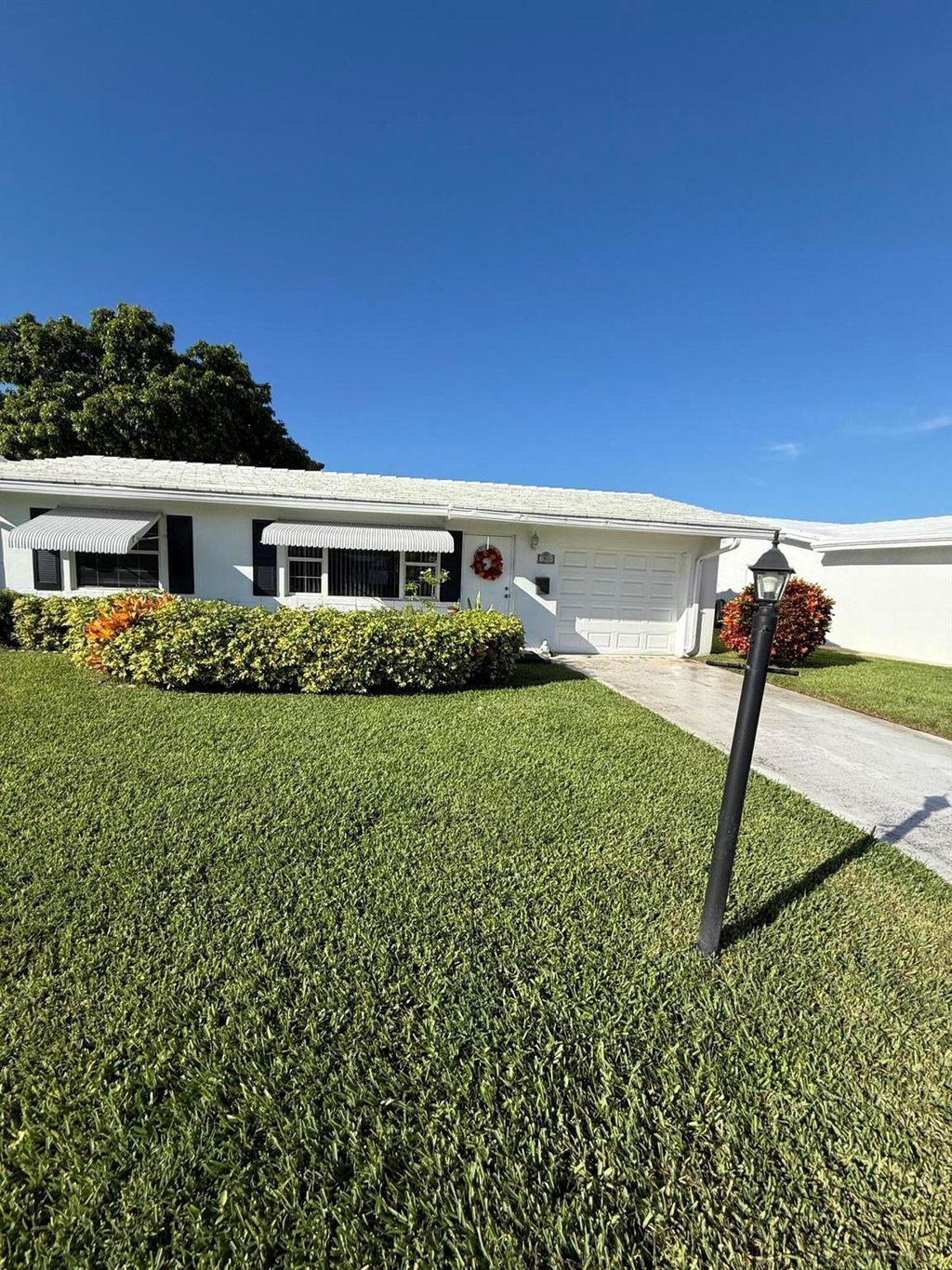 Photo of 1904 SW Golf Lane, Boynton Beach, FL 33426 (MLS # R11125405)