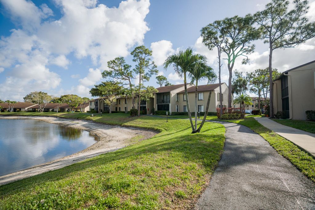 Photo of 707 Sunny Pine Way #C2, Greenacres, FL 33415 (MLS # B26001673)