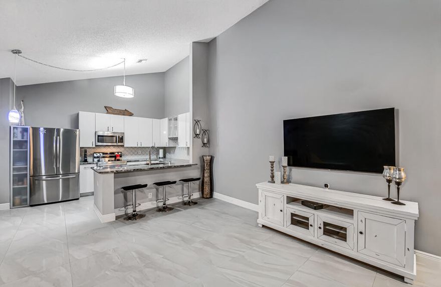 Welcome home to this beautiful and spacious 3 bedroom, 2 full bath home located in the desirable Barrwood neighborhood. This property features a new roof and a modern updated interior with granite countertops, stainless steel appliances, and large ceramic tile flooring throughout. Residents of this community enjoy a variety of amenities including a swimming pool, tennis courts, basketball court, clubhouse, and a scenic walking path around the lake—perfect for relaxing or staying active. Don't miss the opportunity to own a stylish and comfortable home in a fantastic community!