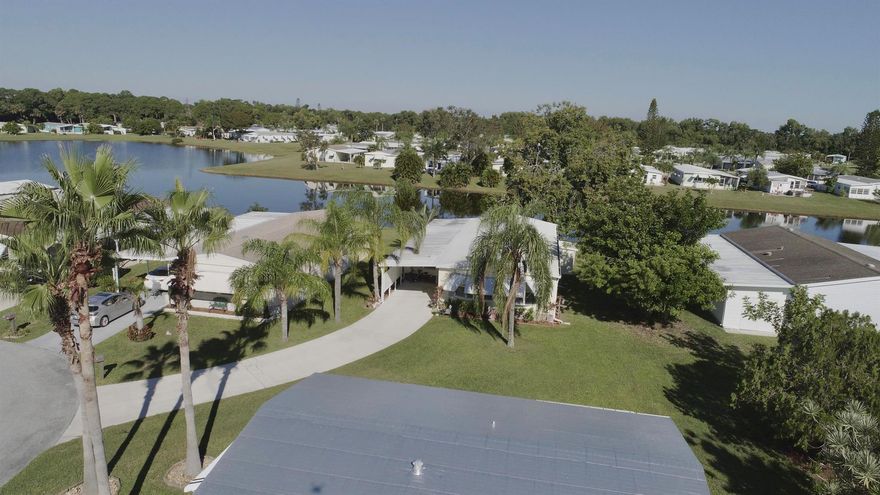 WELCOME HOME to this beautifully REMODELED, WATERFRONT home in the 55+ community of Spanish Lakes Golf Village!  NEW kitchen, floors, appliances, water heater.  This home is MOVE IN READY!  Enjoy the wide water view from your back patio!  This home has 2 bedrooms, 2 bathrooms, and is located at the end of the Cul de sac!  Roof replaced in 2023!  Schedule your private showing today, this home won't last long!