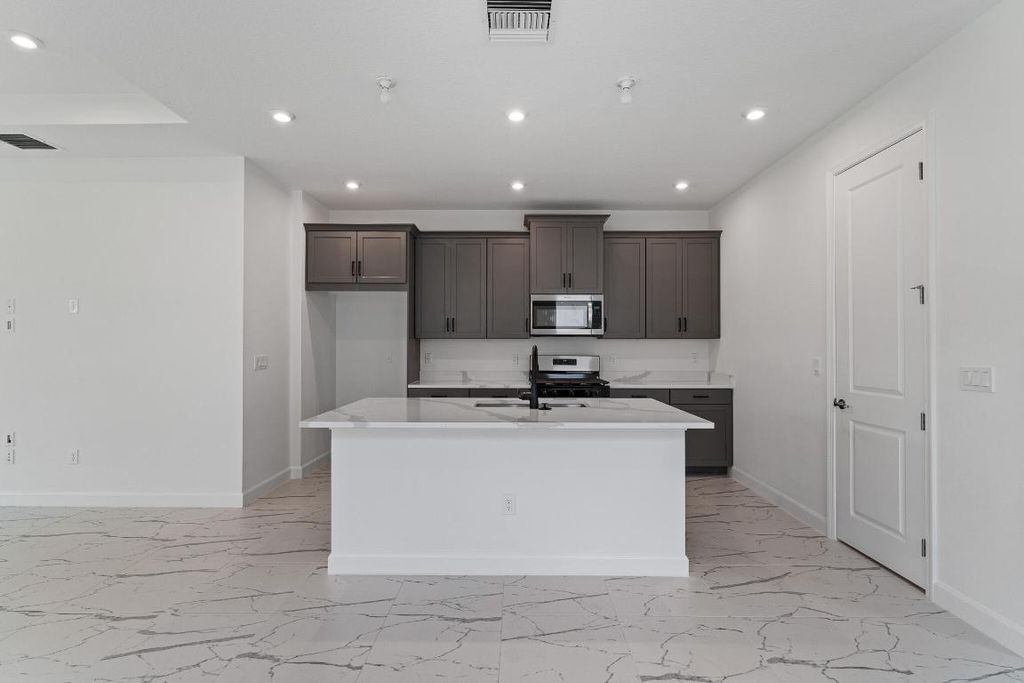 Photo of 9141 SW Remy Lane, Port Saint Lucie, FL 34987 (MLS # R10989623)