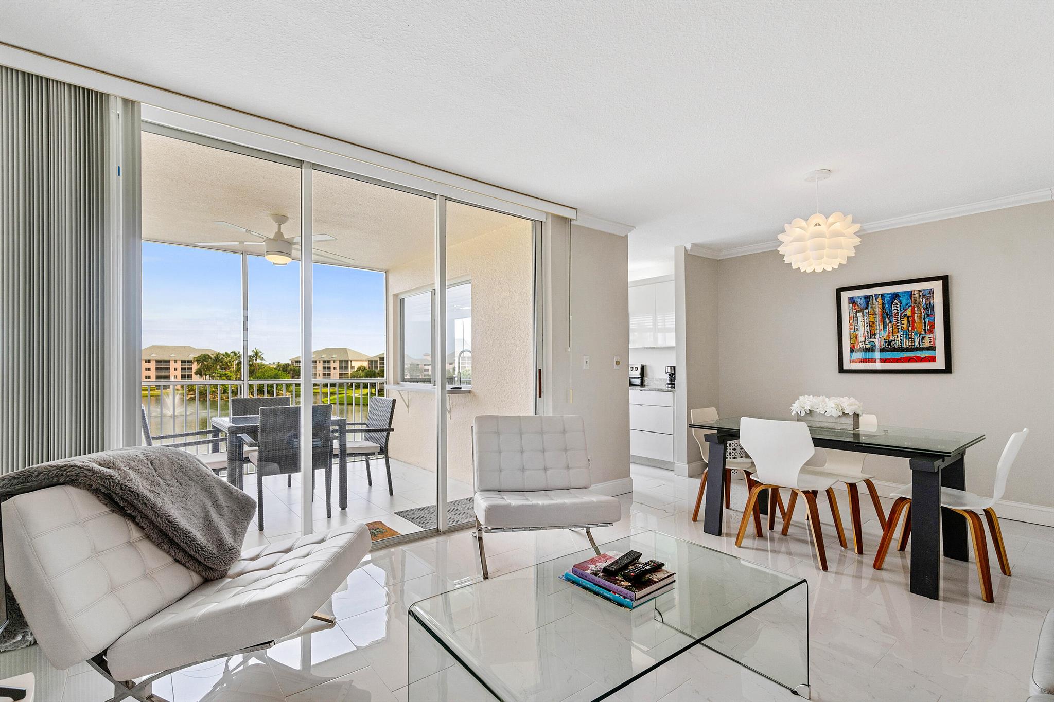 Available for your winter getaway in Jupiter, Florida. Looking for a condo that offers modern upgrades, an unbeatable location, and breathtaking lake views? ** Completely renovated and fully furnished, this 1-bedroom, 1.5-bath condo boasts sleek tile floors, upscale furnishings, and an updated kitchen with stainless steel appliances. ** Enjoy panoramic lake views from the living room, dining room, kitchen, and covered, screened balcony. The inviting bedroom features a luxurious king-size bed for ultimate relaxation. The community also offers a resort-style pool adjacent to the full-service restaurant, Twisted Tuna. Just a short walk to the beach, grocery shopping, and dining. This home perfectly blends style and convenience.