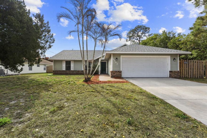 Move-in ready and perfectly located in the heart of Port St. Lucie! This well-maintained home features a 2022 roof, fully fenced backyard, and NO HOA -- giving you flexibility and freedom with no extra fees or restrictions.

Offering 3 spacious bedrooms plus a versatile den/flex space ideal for a home office, gym, playroom, or additional guest area. The updated kitchen features modern finishes and opens seamlessly to the main living spaces, creating a comfortable flow for everyday living and entertaining. Enjoy tile and laminate flooring throughout -- no carpet anywhere for easy maintenance.

Step outside to your fully fenced yard, perfect for pets, kids, or creating your own backyard oasis. Plenty of room for outdoor entertaining, gardening, or even adding a pool.