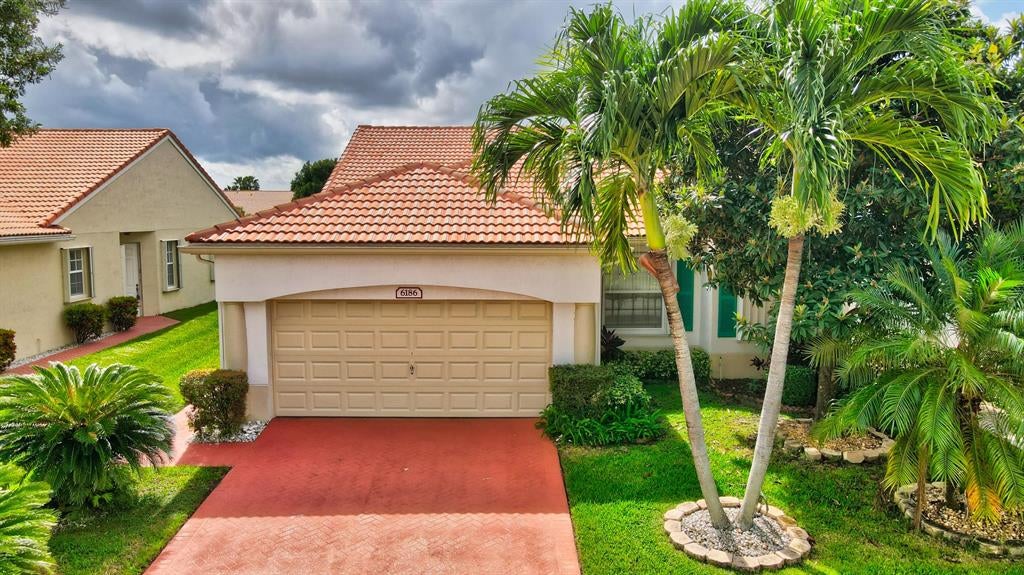 Photo of 6186 Heliconia Road, Delray Beach, FL 33484 (MLS # R10659310)