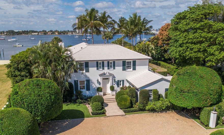 Landmarked Colonial Revival style 2 story on the Intracoastal with panoramic water views. Designed by Gustav Maass in 1936 this elegant home features 5 bedrooms,  5 full baths,  2 powder rooms and 6,762 total square feet. Beautiful tropical gardens surround the property.  90' water frontage, deep water dock, heated fresh water pool, superb loggia for entertaining. 2 car garage and private gate access to the Lake Trail.