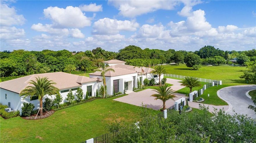 Perfection in Sunshine Ranches StoneCreek. The brand new "Mandarin" is a 10,917SF modern estate, spanning 2.15 acres. The visual stunner welcomes you through privacy gates, opening to a Great Room of floor-to-ceiling glass and expanding to 6BR/6BA/2 half-baths, private library, game room, gourmet kitchen, wine room & bar. Spacious Owner's Suite boasts morning bar, lavish spa and private Zen garden. Impact glass, full A/V system, 50x19 pool, 12x9 spa, 4-car garage & alfresco dining complete the offering.