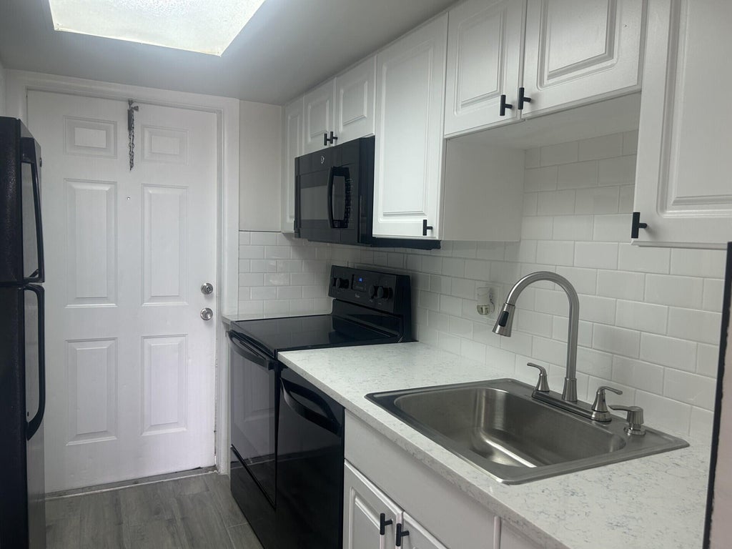 Photo of 1500 Crescent Circle #B211, Lake Park, FL 33403 (MLS # B26061230)