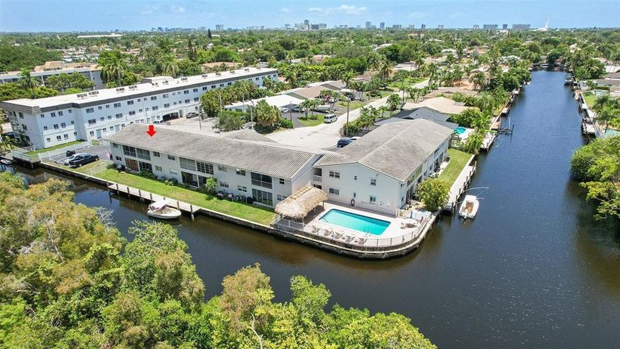 Remodeled canal-front 2-bedroom, 2-bath condo located in the sought-after Cypress Anchorage community. Enjoy serene water views from your spacious private patio, perfect for relaxing or entertaining. Living areas are fully tiled, with laminate flooring in both bedrooms. The kitchen features granite countertops and warm honey-toned cabinetry. This charming unit comes with a new roof, and an assigned parking space. This prime location is near shopping and dining, this is the perfect opportunity to live in East Ft Lauderdale.