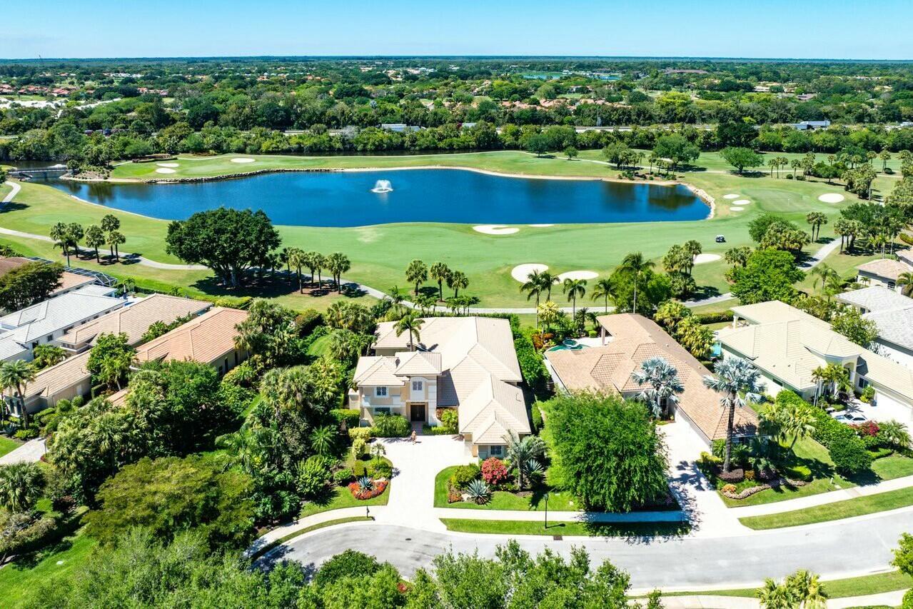 Welcome to 55 Somerset, an Elegant Courtyard Custom Estate in Prestigious Ballenisles Country Club overlooking breathtaking golf and pool views.Nestled on a private corner lot in a cul-de-sac, this spacious home offers a unique blend of comfort, privacy and functionality. The over 3400 sq ft single story main residence features 3 bedrooms and 4 full baths, complemented by an attached 2-story casita (under air space size TBD) with 2 additional bedrooms, 2 full baths, a wet bar, balcony overlooking perfect picturesque views and a private entrance to the second level via exterior stairs.The extremely bright and light-filled interior boasts 12x12 tile flooring, carpeted bedrooms, electric window treatments and a phenomenal floor plan in your entertaining area.