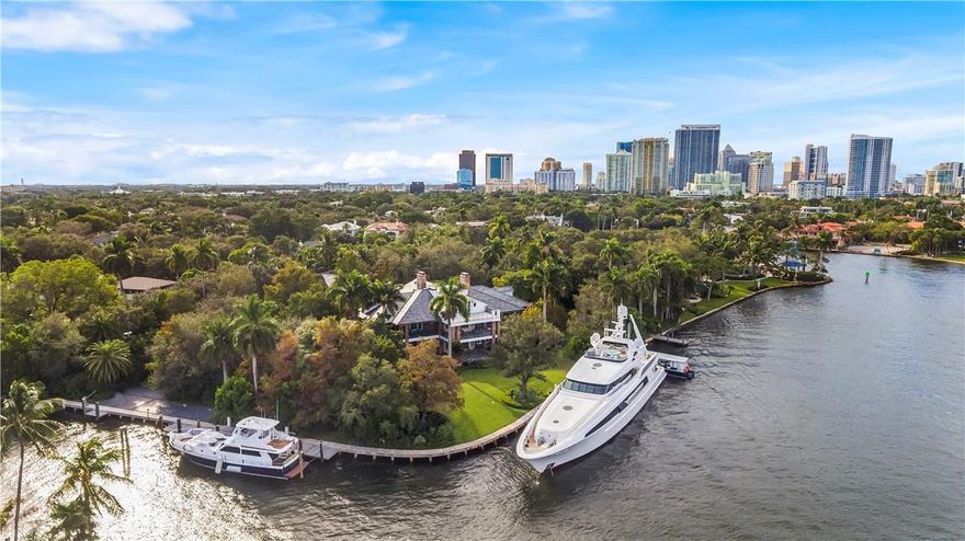 Seeking the privacy & serenity of a true Estate property?  Approximately 500 ft of deep water frontage will accommodate TWO 100ft + or multiple yachts! Almost 2 acres of property - this is one of Fort Lauderdale's most significant Estates! Established grounds & gardens were designed & created by famous landscape artist Raymond Jungles. This substantial custom built retreat has a Southern Coastal architectural inspiration which is both timelessly elegant & perfectly presented. Warmth & detail from exotic, rare woods & finishes feature throughout.  Chef's kitchen, flowing entertaining areas & large bedroom suites.  Most rooms feature New River views. There is a large Game Room on the ground level & 3rd Level Club Room with bar & roof terrace. Luxurious Master Wing  Large separate Guest House