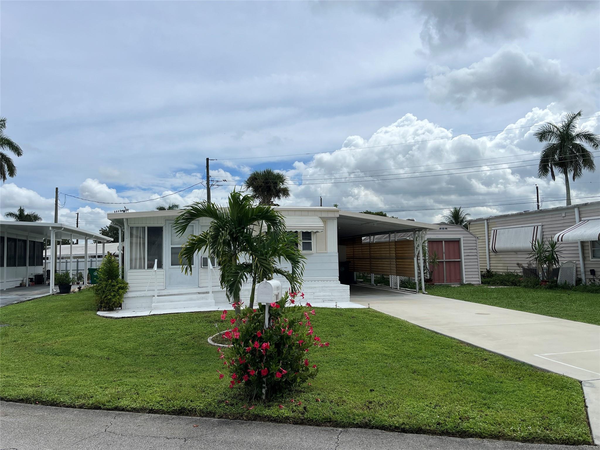 Don't miss out on this completely furnished, fully stocked, move-in ready, single wide, 2 bedroom, 2 bathroom, including a sunroom, covered patio, and shed. Enjoy the quiet 55+ community of Park City where you own the land, with a low HOA. This home is close to the main clubhouse and pool, priced to sell! There is a plethora of recent updates too long to mention, including BRAND NEW ELECTRICAL PANEL, new appliances, vinyl plank flooring, new washer/dryer, freshly painted, new door hardware, new toilets and vanities in both bathrooms, new blinds, new window A/C in sunroom, new couch, coffee table, dining room table and chairs, new mattress, and so much more! Make this house your own.