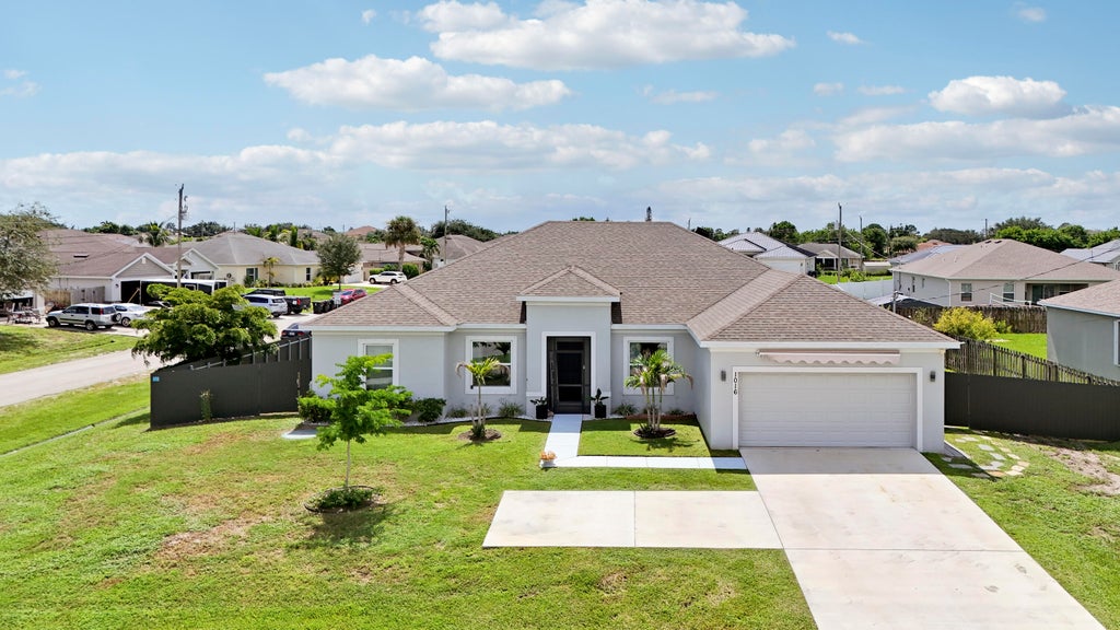 Photo of 1016 SW Paar Drive, Port Saint Lucie, FL 34953 (MLS # B26076946)