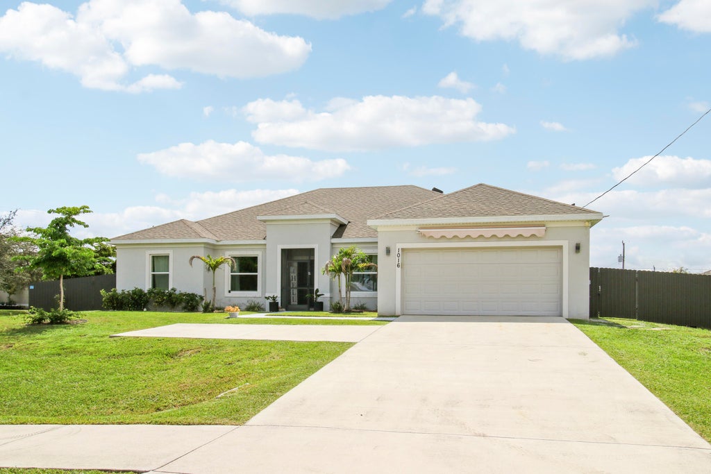 Photo of 1016 SW Paar Drive, Port Saint Lucie, FL 34953 (MLS # B26076946)
