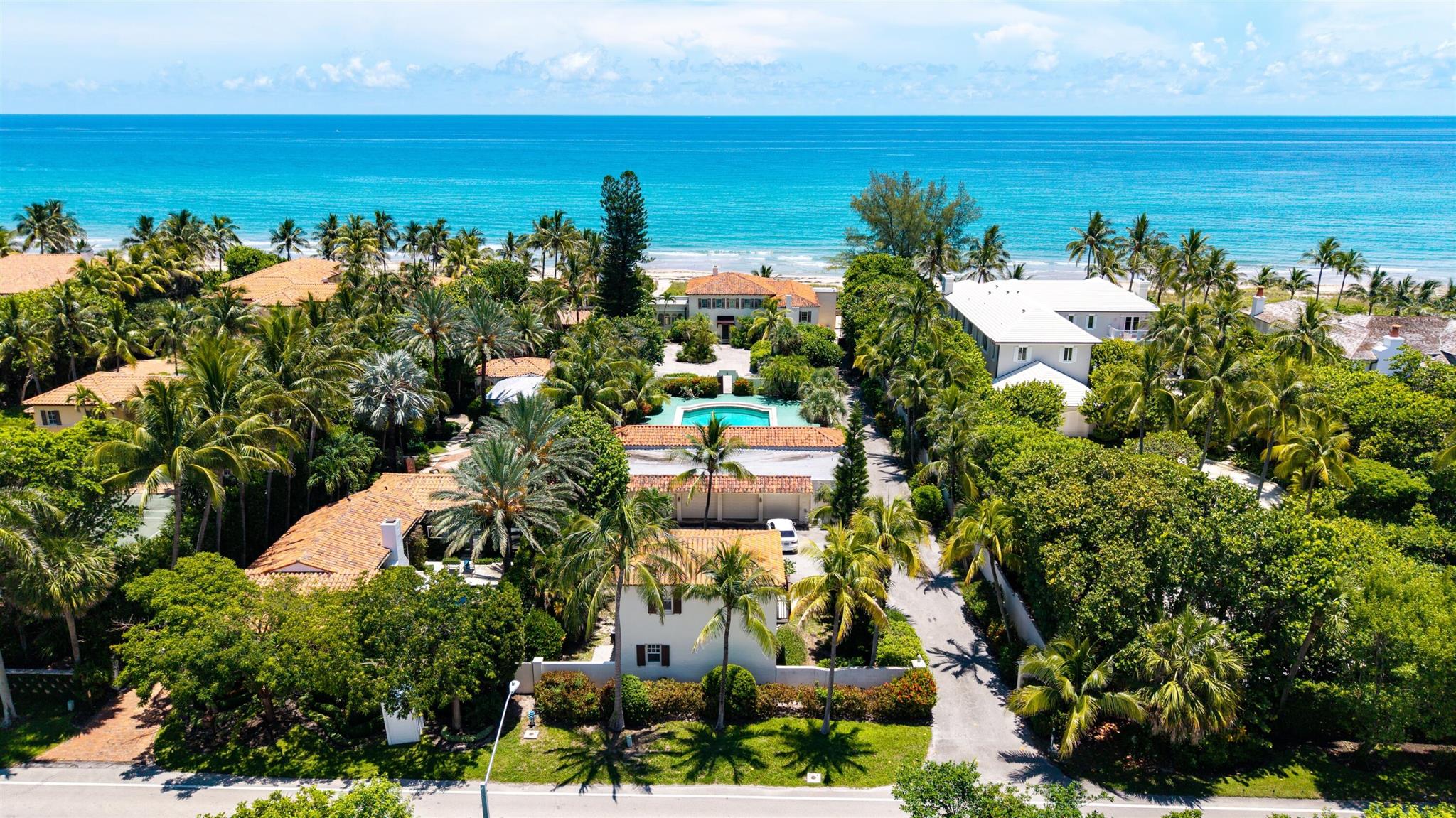 Step into a timeless piece of architectural history with this one-of-a-kind oceanfront estate in the prestigious coastal enclave of Gulf Stream. Set on over 121 feet of direct Atlantic Ocean frontage, this iconic compound offers the rare chance to own a property with a storied past. The property was constructed by renowned builder C.G. Warner and completed in 1933 as a walled and gated sanctuary. At the time, its expansive swimming pool was the largest private pool in all of Palm Beach County -- a bold symbol of leisure and luxury. Whether you choose to preserve its rich heritage or craft a new vision on this iconic site, 1443 N Ocean Blvd represents a once-in-a-generation opportunity to own a cornerstone of Gulf Stream's oceanfront legacy.