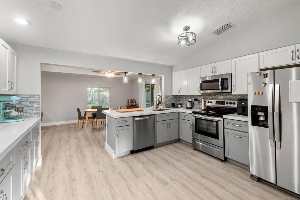 Photo of 1314 Elmbank Way, Royal Palm Beach, FL 33411 (MLS # R11138465)