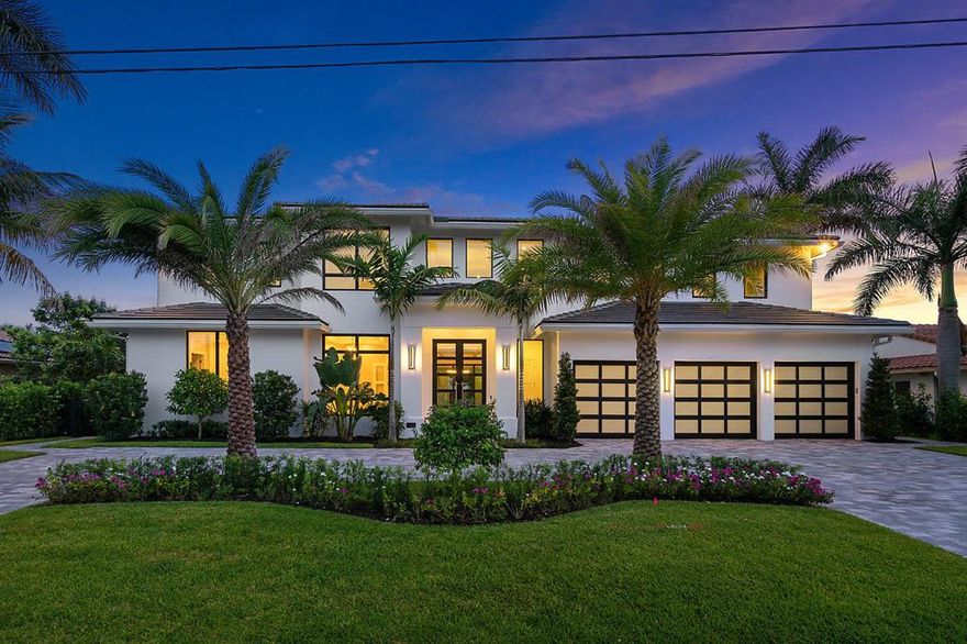 This is the ONE!  A unique PARADISE for boaters, beach lovers, car collectors, or for those that simply enjoy the refined modern elegance captured by the design and finishes of this newly constructed two-story modern masterpiece. Nestled on a rare and highly desirable private south-facing wide canal lot on the most private street in Tropic Isle, this home offers 5-star luxury, spectacular waterfront living and a walkable lifestyle to shops, grocery stores, restaurants and the beach!

As the only move-in-ready new construction home available for under $4.2M in Delray Beach and Boca Raton, and one of the very few waterfront properties with natural gas appliances, this extraordinary offering comes complete with upscale accommodations for up to 4 cars and the yacht of your choice with a new 72' concrete dock and new 20,000 lb boat lift on 92' waterfront on extra-wide canal, perfect for larger boats.  

Fully outfitted for the buyer of discerning tastes, this seductive luxury retreat affords TWO opulent master suites with free standing tubs and oversized walk in showers - one on each level, 3 generous bedrooms with full bathrooms and walk in closets, a private office, a laundry room for each level, stunning professional-grade chef's kitchen with 11' cabinetry, a sun drenched yet secure garage for up to 4 cars, elevator and dramatic resort-style grounds featuring a refreshing pool and spa with sun shelf, all surrounded by a canopy of Hybrid Date palms and Sylvester palms that provide dappled shade and areas of full sun.

Private and secluded, you'll enjoy sophisticated, clean-lined interiors spanning 5,867 square feet with an abundance of custom designer upgrades throughout. Among these are gorgeous wide-plank white oak floors, sleek large format tiles in every bath, exquisite designer lighting fixtures throughout, generous walk-in closets in every room including two for each master, plus added touches like a doggie shower on the main floor, a 70-foot glass staircase railing, 10-11' ceiling heights throughout and double-height ceilings in the foyer. The gourmet kitchen steals the show with built-in column Sub-Zero fridge and freezer, double Wolf ovens, two Bosch dishwashers, a Perlick under-counter beverage fridge, wine fridge, a natural gas Wolf cooktop, and floor-to-ceiling cabinetry for a high-end look and feel.

Walls of 10' tall glass showcase incredible pool views from the open-concept living, dining, family room and kitchen, which are all proportioned for effortless entertaining indoors and out. The living area is adorned with floor-to-ceiling quartz slabs surrounding the natural gas linear fireplace to provide a striking focal point for the first floor. Open the 16' glass walls in the living room along with the 10' glass walls in the adjacent coffered dining space and seamlessly merge the indoors and outdoors connected by a covered patio that has indoor finishes, another gas fireplace and the option to lower a 20' wide motorized screen. From the moment you walk through the front door you feel as if your waterfront oasis flows indoors as the sun shelf of the gorgeous diamond-finish pool joins the edge of the covered patio offering access to the luxury pool and oversized spa, all overlooking a grand canal view. Turn on the LED pool lighting, the 3 bubblers in the sun shelf and the natural gas fireplaces and your are drenched in the sounds and sights of your tropical paradise.  

Stow all your toys in any of the three impact resistant glass garages, including a bay that was built to accommodate for a car lift. Smart Home features take this property to the next level with lighting and music controls, surround sound, security, and more. Additionally, the entire estate except for trusses and staircase is concrete built, including the first and second floor walls and floors, adding a nearly $350,000 structural upgrade. 

Ideally located steps from the hottest restaurants, Whole Foods, Trader Joe's, and white sandy beaches, this modern gem boasts the highest quality construction and finish-out, met by an unrivaled lifestyle that includes golf carts and access to sought-after Boca schools. For the best build, in the best location, with the best views, this Tropical Isle modern has no equal.

Your dream boater's paradise awaits in Tropical Isle at the only brand new construction modern masterpiece on a desirable south-facing wide canal lot for spectacular waterfront living! This turnkey gem, the only move-in-ready new build under $4.2M in Delray Beach & Boca Raton, offers a new dock for a 70' boat and boat lift, resort-style pool & spa w/sun shelf, clean-lined interiors, white oak floors, SubZero-Wolf kitchen, sleek designer baths, walk-in closets in every room, main-floor doggie shower, 70' glass railing, rare 2-level concrete construction, natural gas, smart controls & more. Steps from restaurants, Whole Foods, Trader Joe's & white sandy beaches, this stunner boasts the highest quality finish-out & an unrivaled lifestyle that includes golf carts & access to sought-after Boca schools.