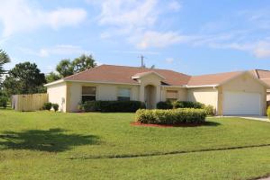 Beautifully maintained 4 bedroom, 2 bath home.  Large open floor plan with formal dining room and large kitchen that opens up to the living room.  Fully fenced back yard with newly pored porch.  Home has newer appliances with all windows and sliding glass doors recently rebuilt.  AC vents just cleaned and all electrical from FP&L pole throughout the home checked and in good working order.