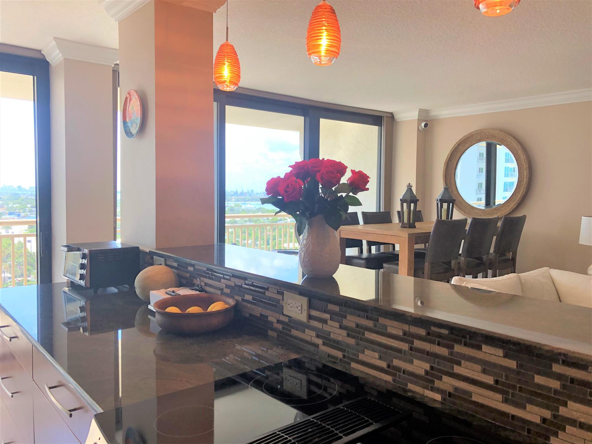 This large condo on the 15th floor in desirable Oceantree on Singer Island has been completely remodeled throughout and has beautiful views of both the ocean and the Intracoastal. Both bedroom suites have their own bathrooms and the family room/bar area also provides additional sleeping accommodations. High end furnishings throughout,. Oceantree is on over 6 acres of beautiful sandy ocean beach with beach services available and has two heated pools, hot tub, picnic gazebos, exercise room, library, community room, parking garage, and more! Must see!