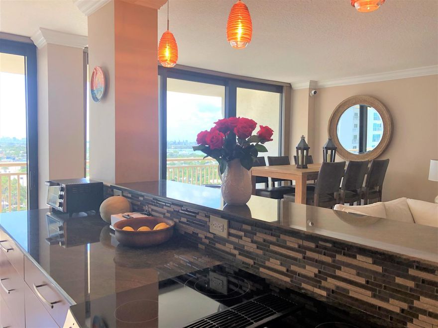 This large condo on the 15th floor in desirable Oceantree on Singer Island has been completely remodeled throughout and has beautiful views of both the ocean and the Intracoastal.  Both bedroom suites have their own bathrooms and the family room/bar area also provides additional sleeping accommodations.  High end furnishings throughout,.  Oceantree is on over 6 acres of beautiful sandy ocean beach with beach services available and has two heated pools, hot tub, picnic gazebos, exercise room, library, community room, parking garage, and more!  Must see!