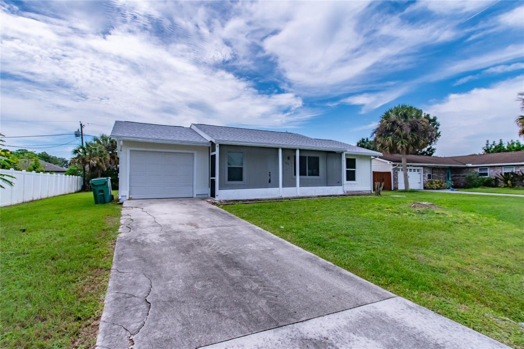 Photo of 180 SW Todd Avenue, Port Saint Lucie, FL 34983 (MLS # F10462054)
