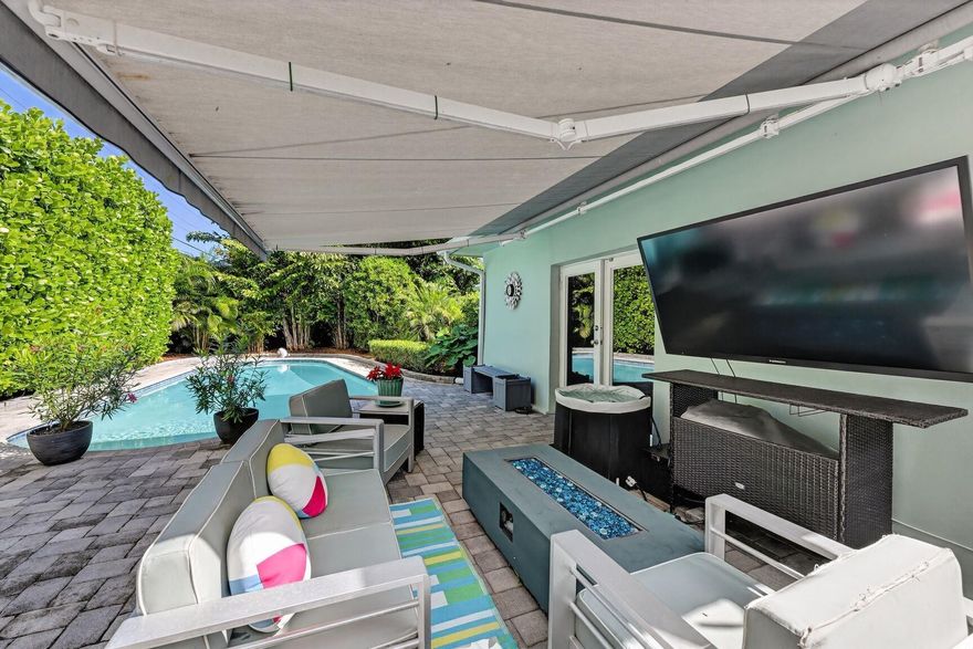 Bask in the sun in this private, tropically landscaped, backyard Beauty!  Quiet Cul de Sac located in the very desirable Cove. Lots of outdoor living in the beautiful pool with new saltwater system, pump, & heater, or relax in the large 4 person hot tub. Prefer the shade? Retreat under the 16ft motorized Sunsetter awning. This home boasts new roof, new porcelain floor tile, bath renovated 7/25, impact windows & doors, & new well water irrigation sys. Plenty of storage in the charming cottage looking, 14 x 8 shed, hurricane rated with electric.  All conveniently located to shopping, restaurants & 5 mins to the beach.