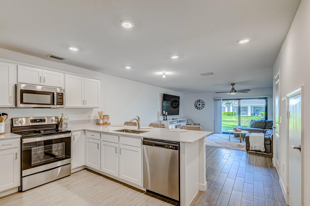Photo of 5007 Woods Edge Circle, Riviera Beach, FL 33410 (MLS # R10962746)