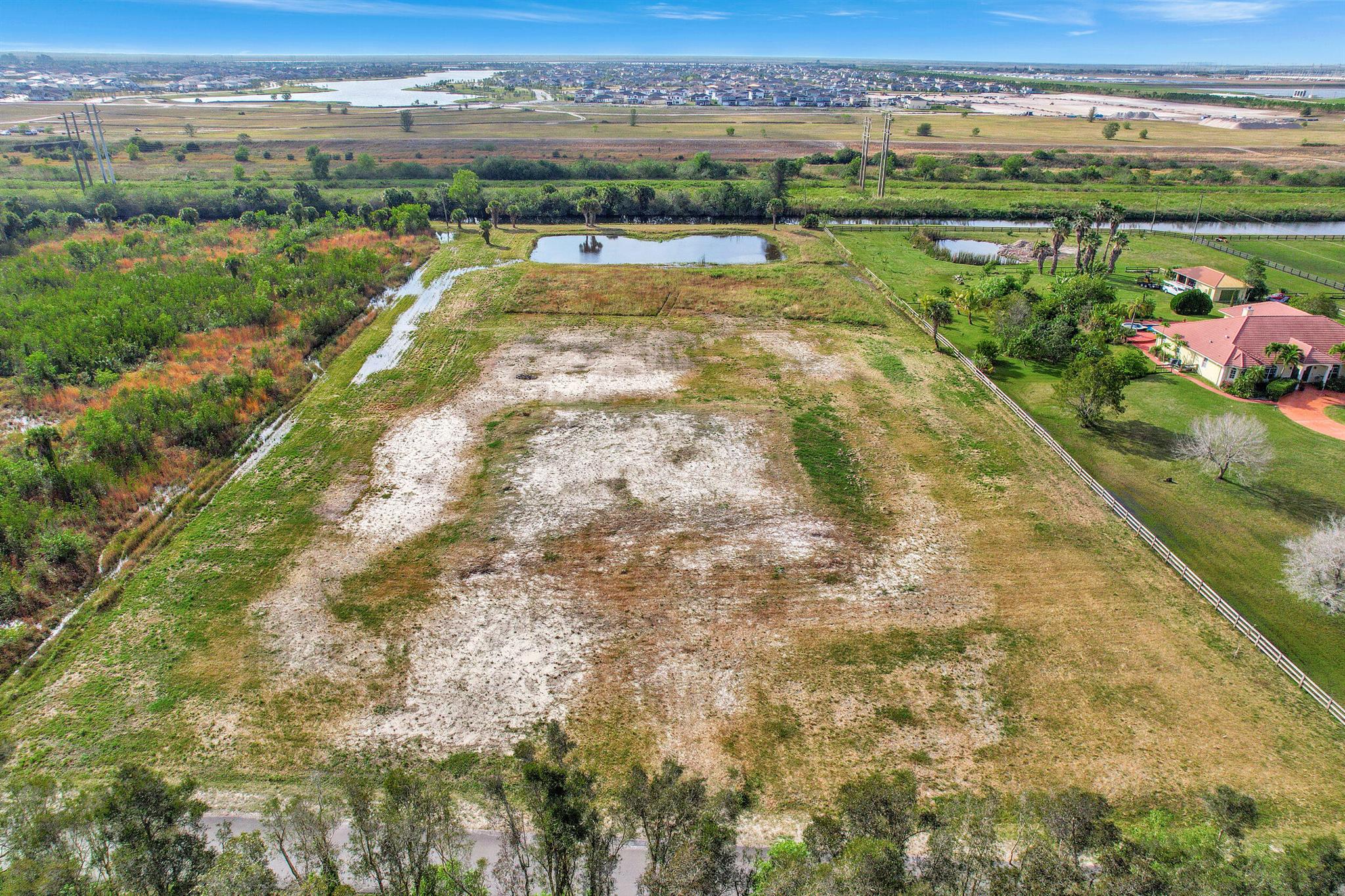 Introducing the perfect opportunity for your dream home on a sprawling 5-acre lot! This property comes with approved site & drainage plans, offering you the ultimate convenience and luxury. Whether you're looking to build your forever home or create a serene retreat, this lot provides the ideal canvas for your vision.Imagine waking up to breathtaking views of the surrounding natural beauty, with ample space to create your own private oasis. The 5-acre lot offers endless possibilities for outdoor activities, from gardening and landscaping to building your own recreational spaces. With plenty of room to roam, you can enjoy the tranquility and seclusion that comes with owning such a vast piece of land.Immerse yourself in the serenity of nature while still enjoying the modern living