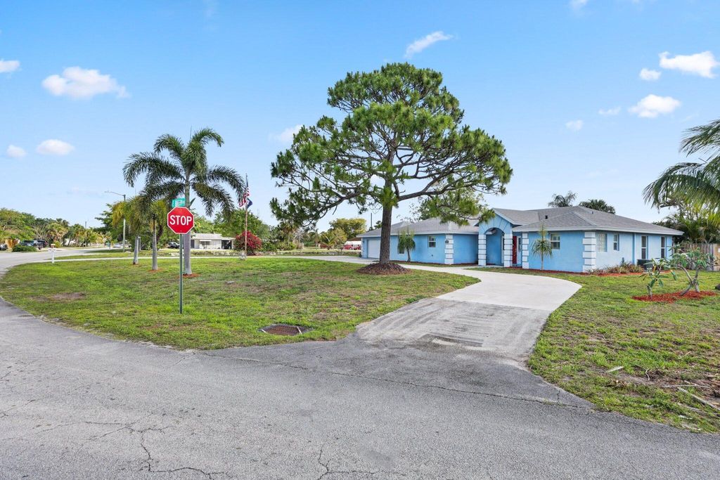 Photo of 1750 E Breezy Lane, West Palm Beach, FL 33417 (MLS # R11080782)
