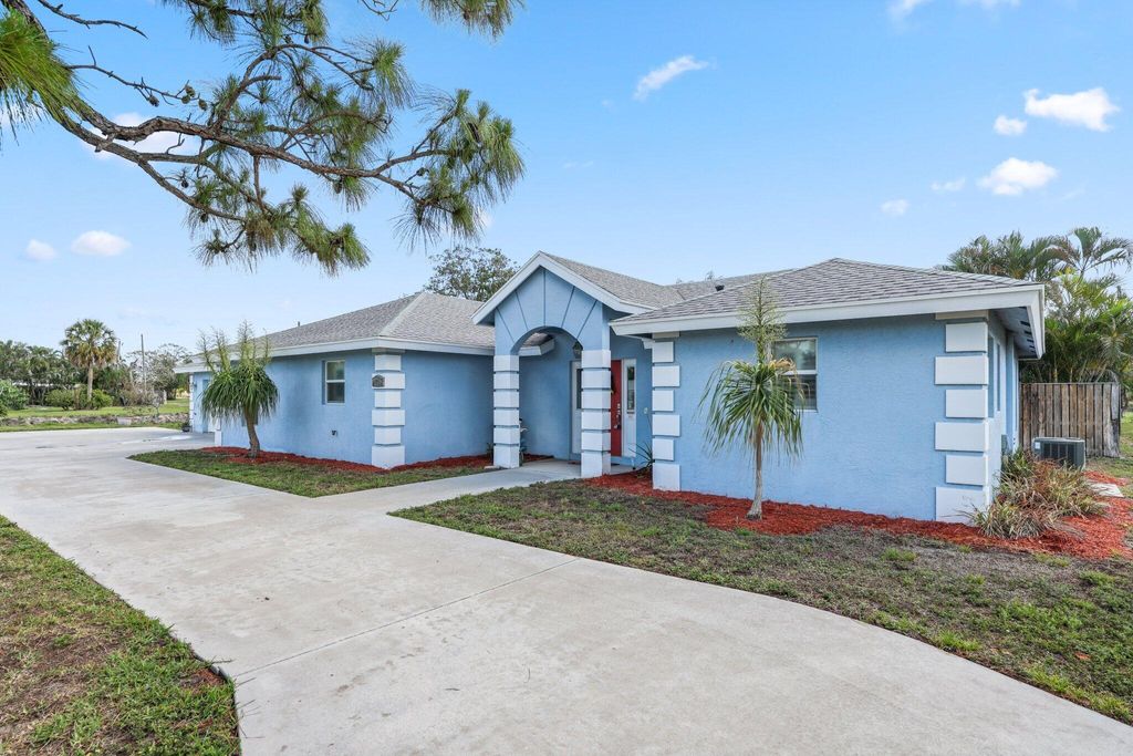 Photo of 1750 E Breezy Lane, West Palm Beach, FL 33417 (MLS # R11080782)