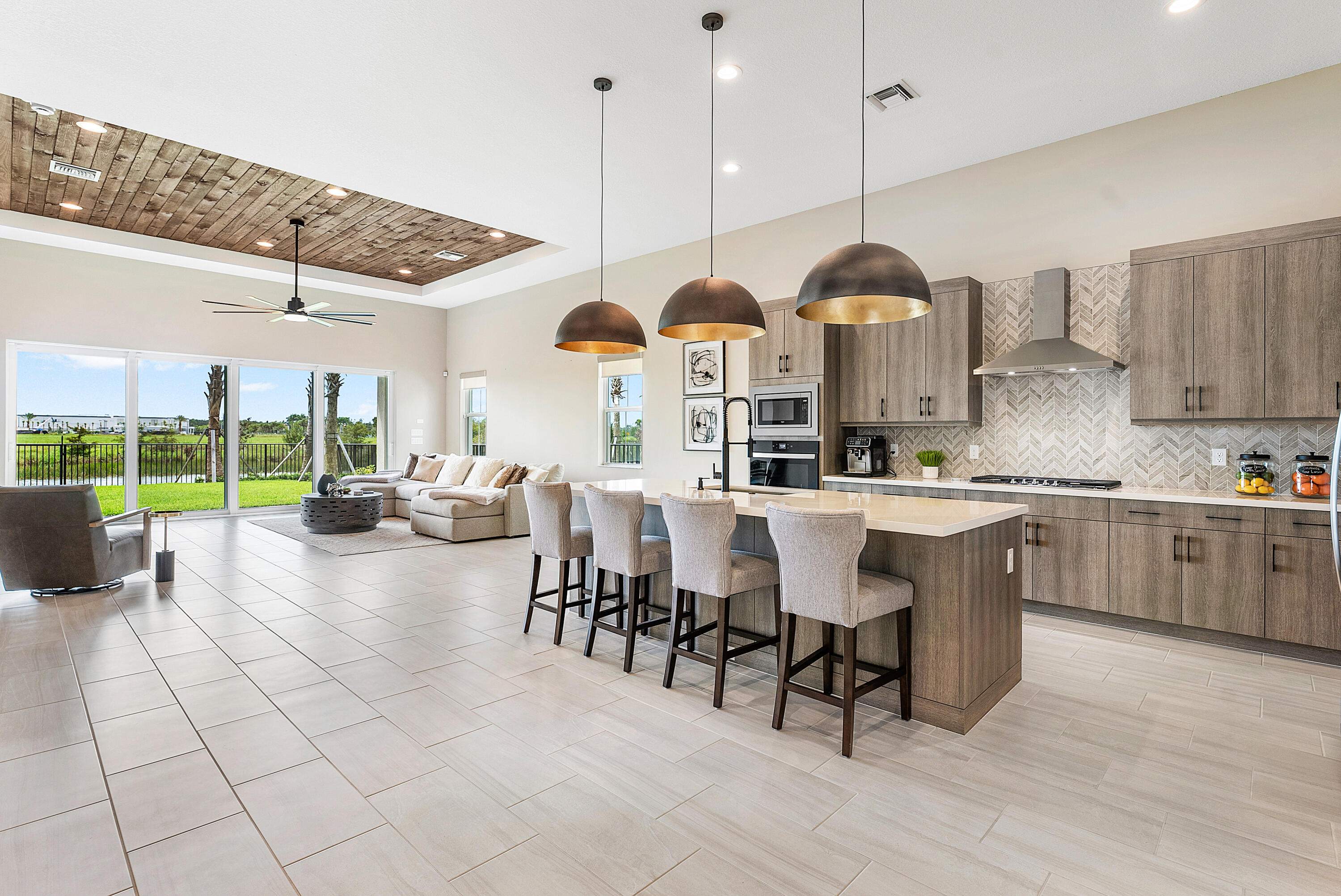 Discover modern elegance in the sought-after Avenir community of Palm Beach Gardens! This 3-bedroom, 2.5-bath home features an open, sun-filled layout with a chef's kitchen boasting quartz countertops, stainless steel appliances, and a spacious island. The great room's 16-foot sliders open to a covered patio and lush backyard, perfect for indoor-outdoor living. Unwind in the serene primary suite with a spa-like bath and walk-in closet. Enjoy Avenir's resort-style amenities and a prime location near top dining, shopping, golf, and beaches. Don't miss this opportunity--schedule your private tour today!