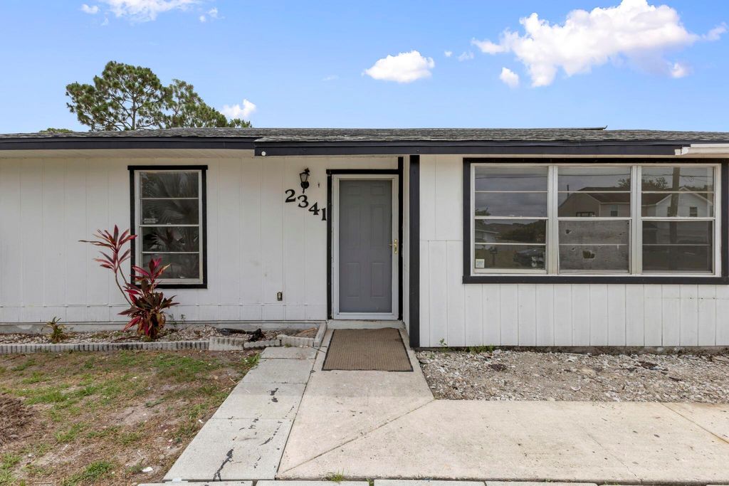 Photo of 2341 SW Cooper Lane, Port Saint Lucie, FL 34984 (MLS # R11090799)