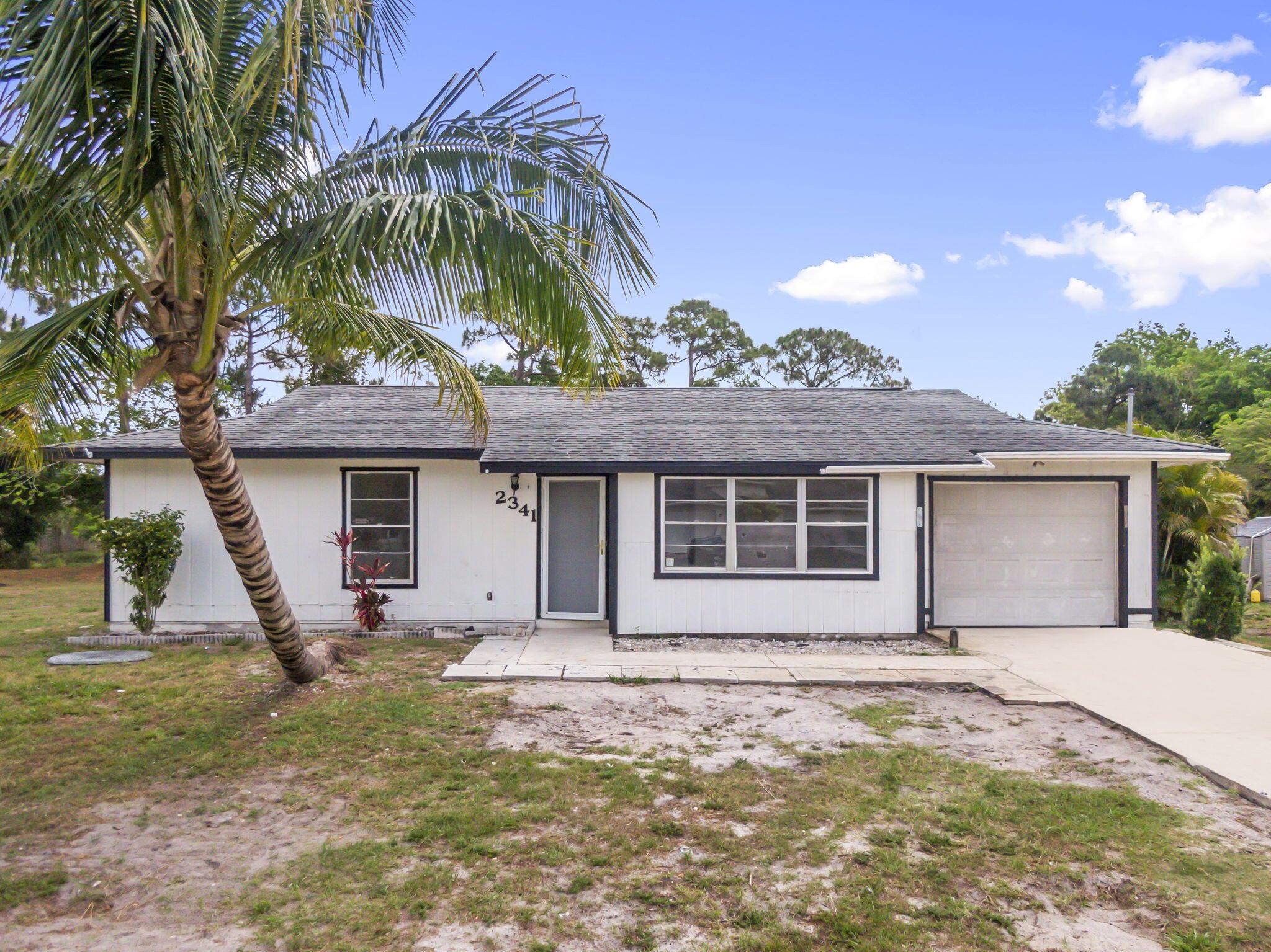 Investor special or starter home in the heart of Port St. Lucie! This 2-bedroom, 2-bathroom home offers a fantastic opportunity for renovation and resale or long-term rental income. The property features a 1-car garage, covered porch, and a spacious backyard with plenty of potential. While the home does need work, it has solid bones and is nestled in a quiet, established neighborhood with no HOA. Conveniently located near schools, shopping, dining, and major highways.