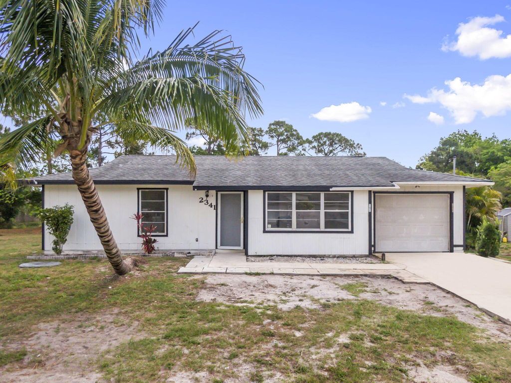 Photo of 2341 SW Cooper Lane, Port Saint Lucie, FL 34984 (MLS # R11090799)
