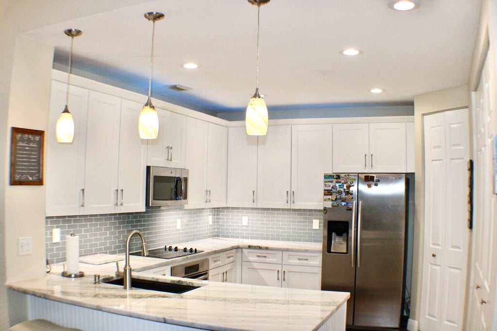 Photo of 2384 SW ISLAND CREEK Trail, Palm City, FL 34990 (MLS # B26065662)